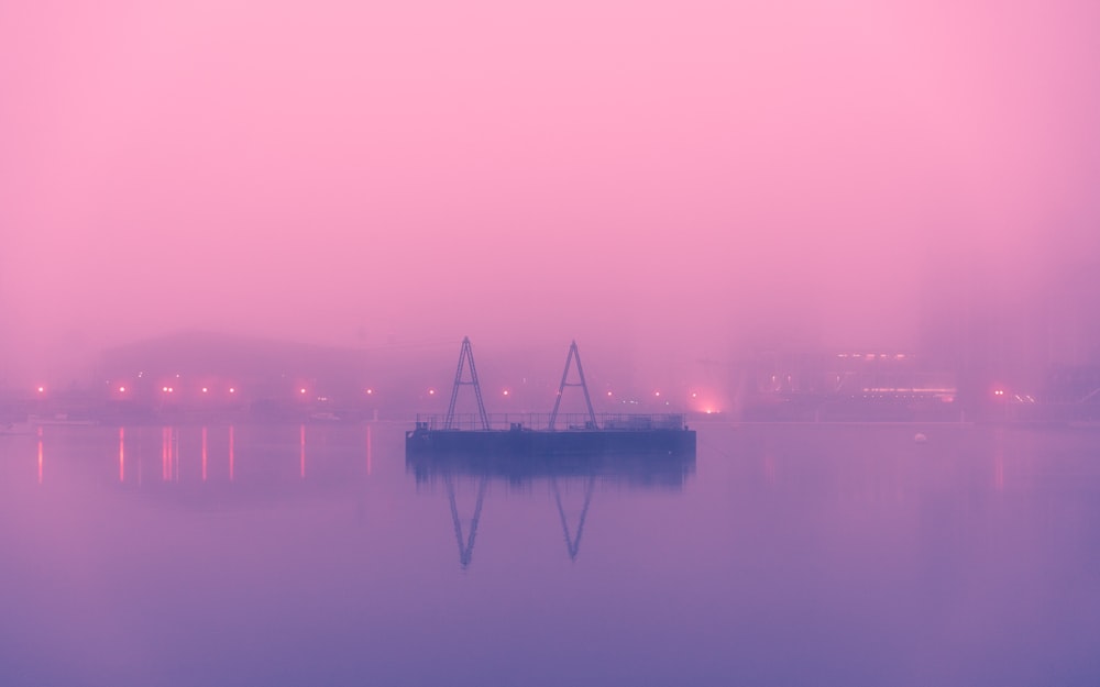 ship on body of water during foggy evening