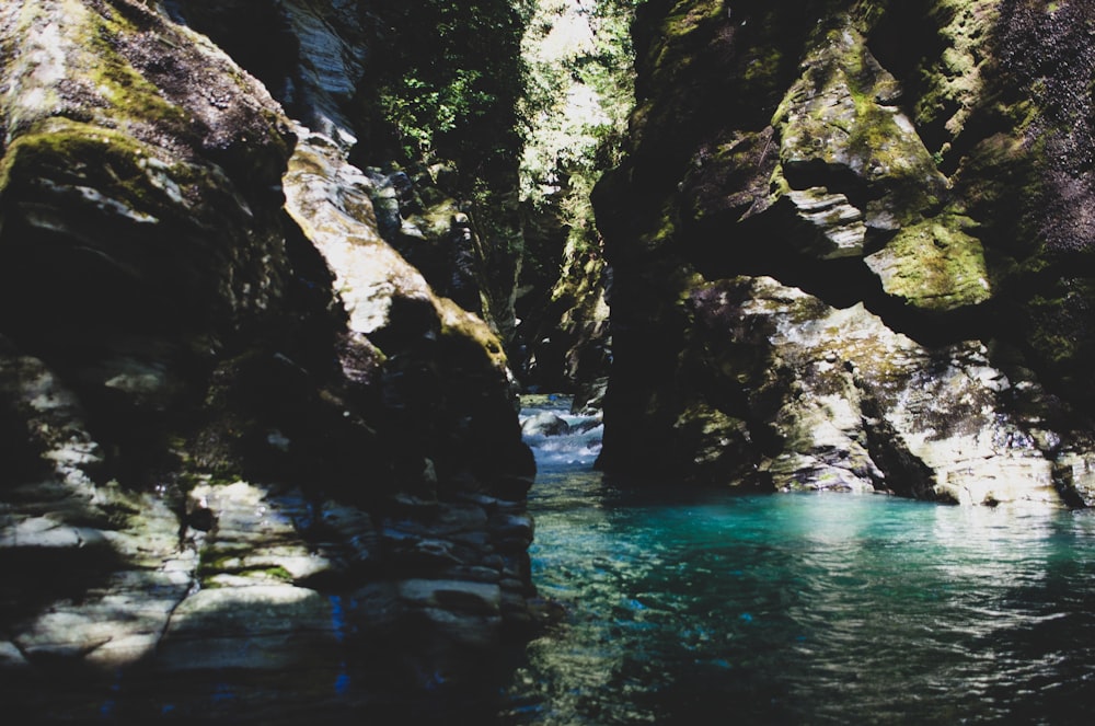 river by rocks during daytime