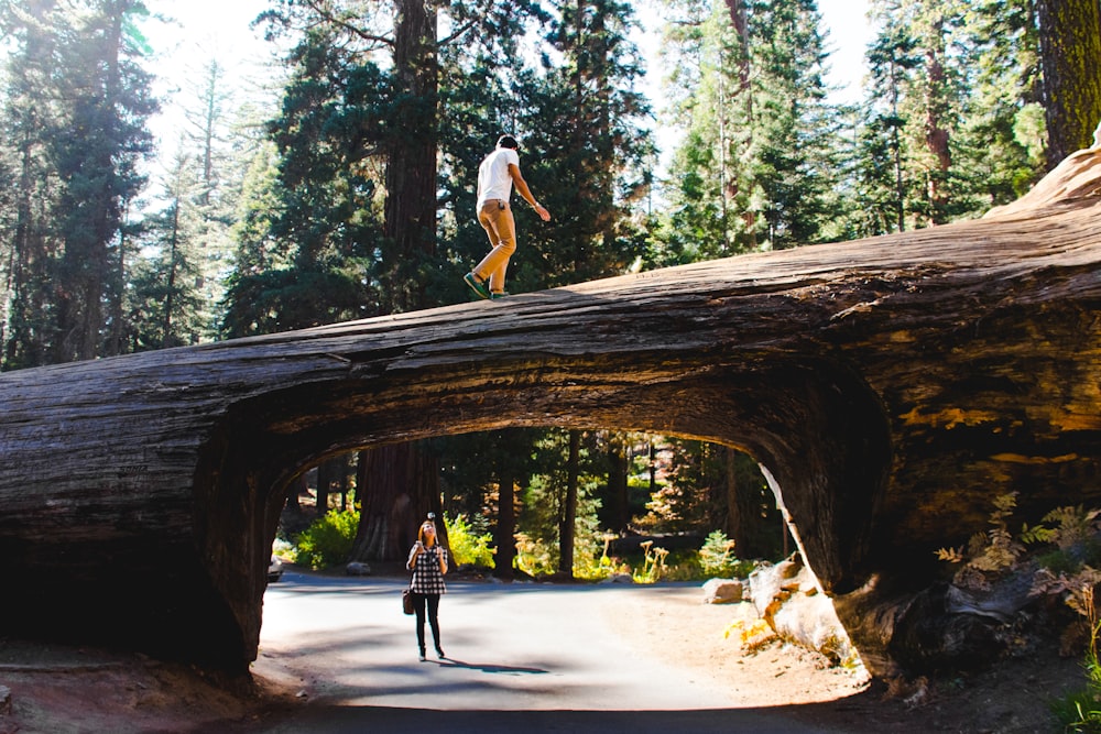 woman wearing black shirt under log