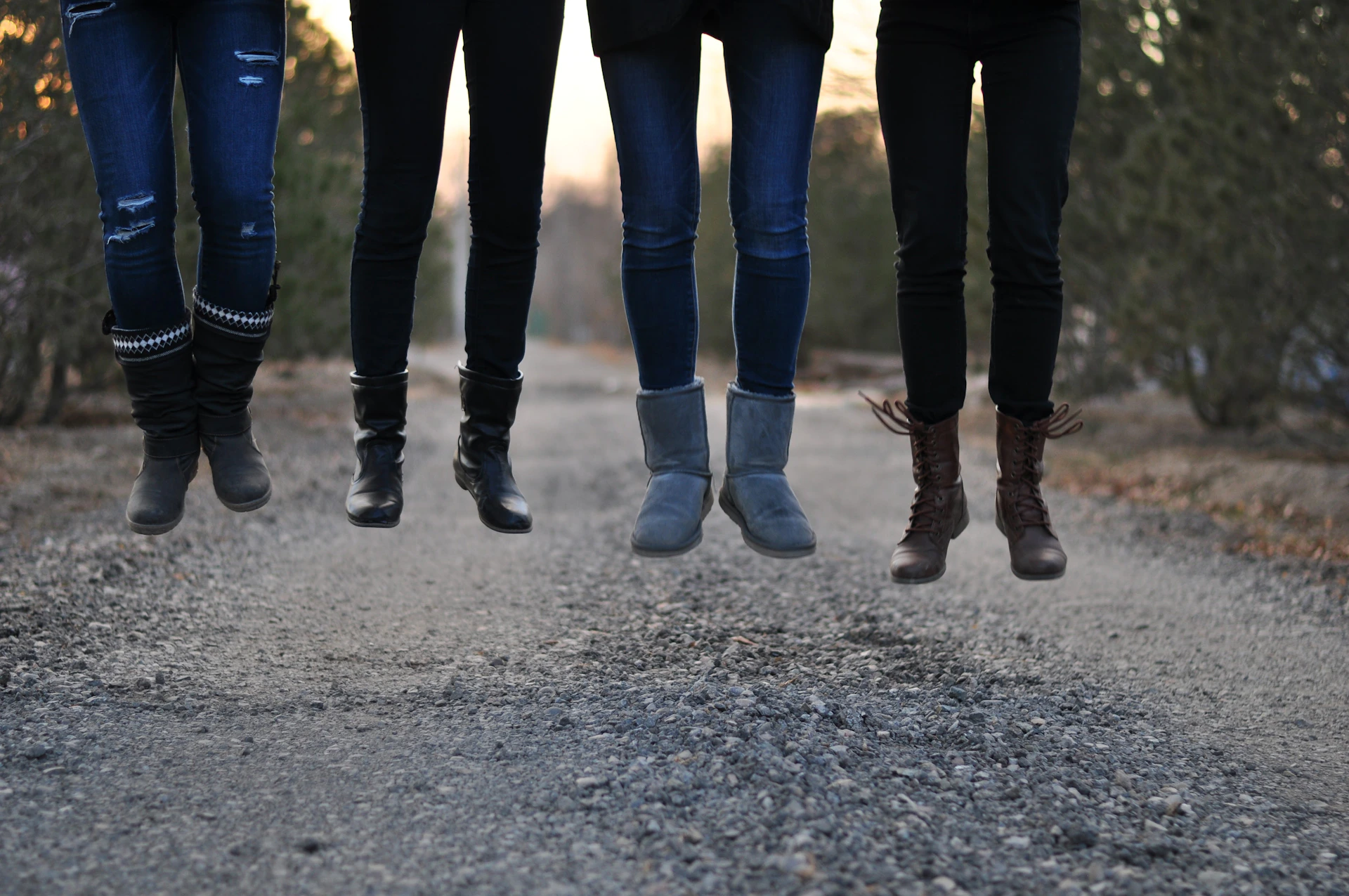 four people wearing boots