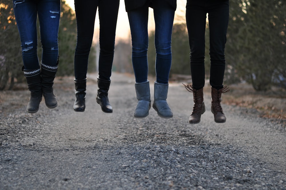 four people wearing boots