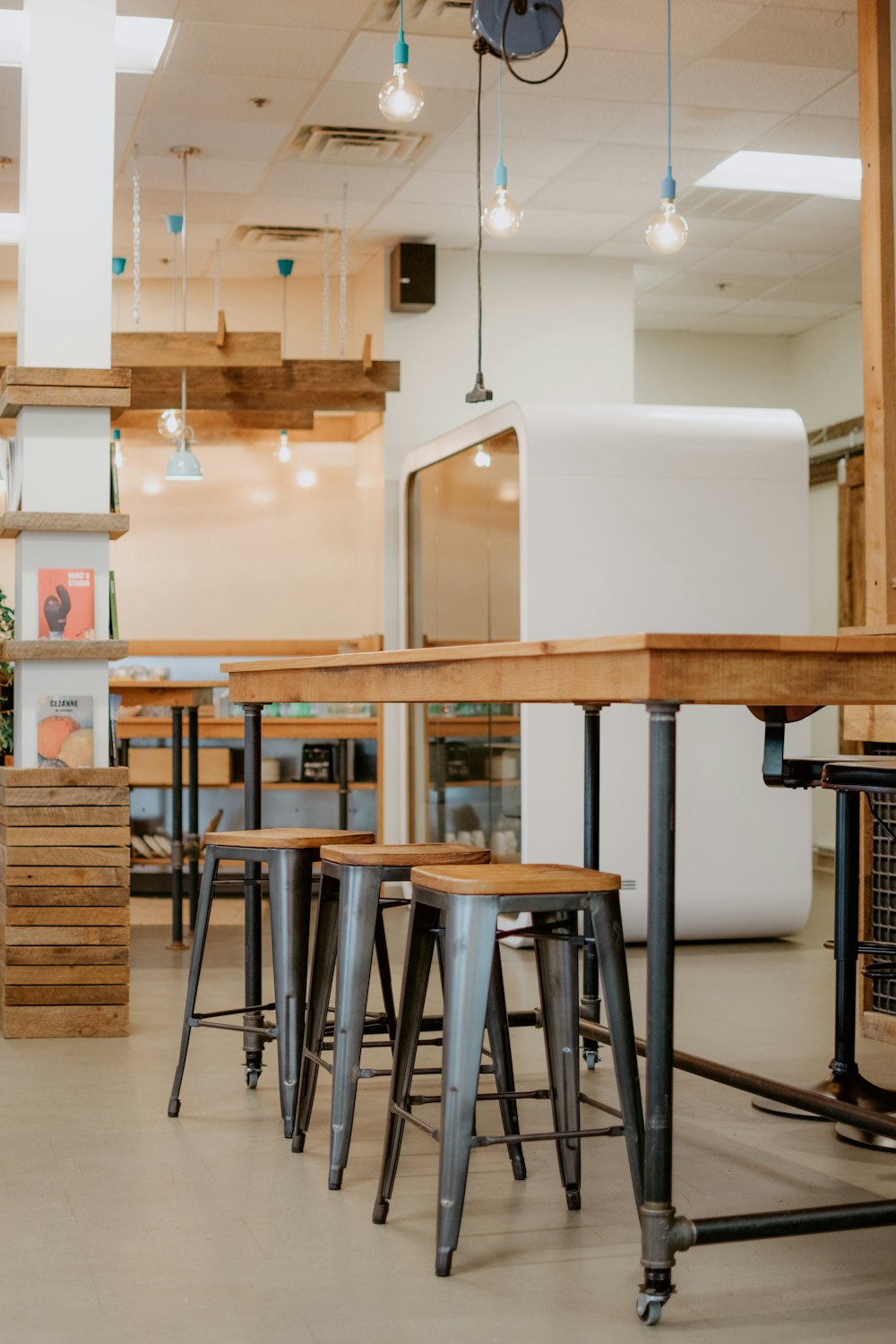 brown wooden and gray metal bar stools