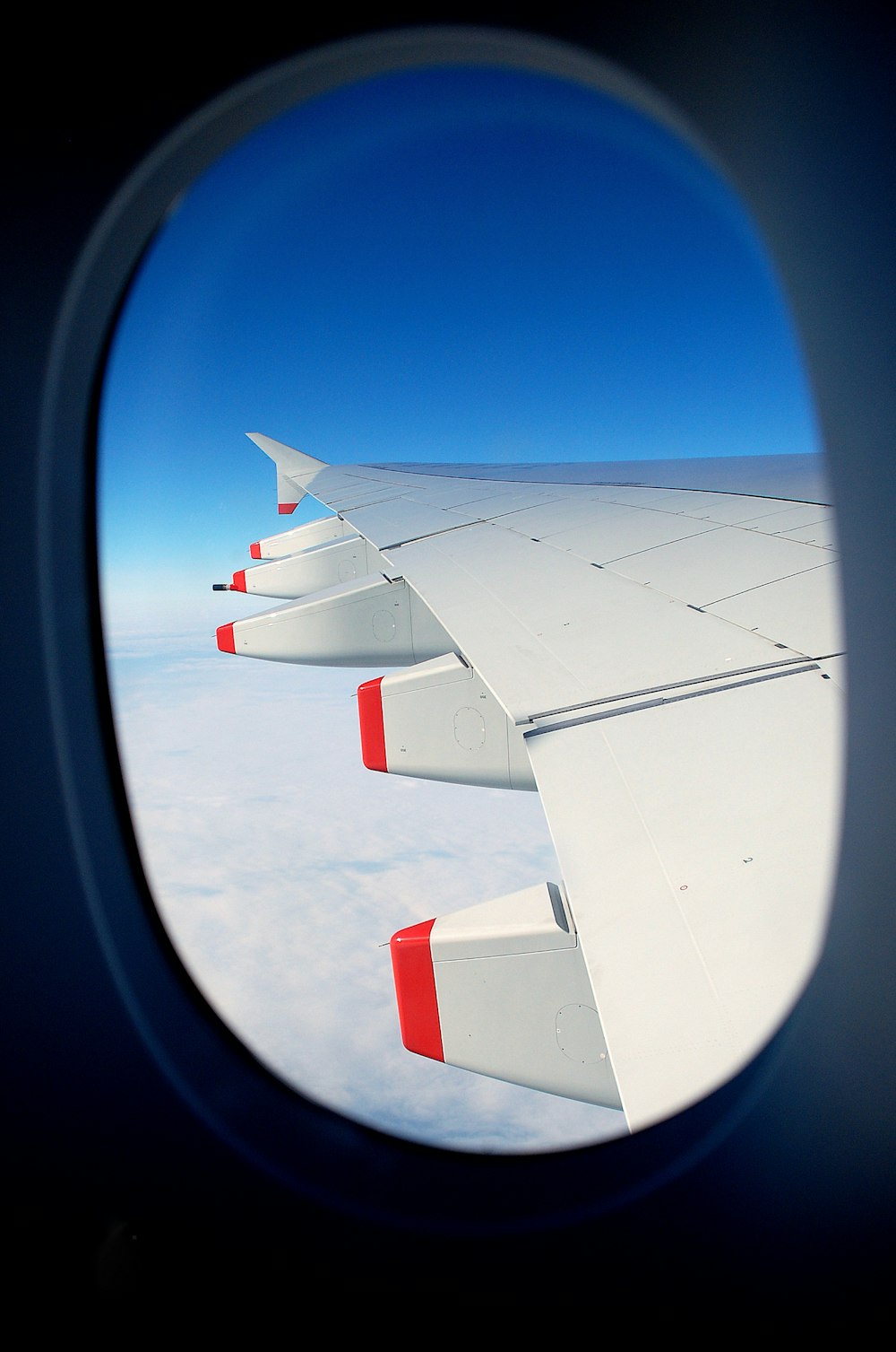 gray and red airplane wing