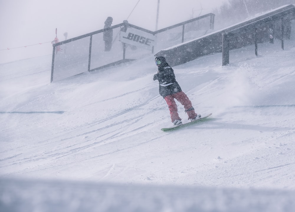 person riding on snowboard