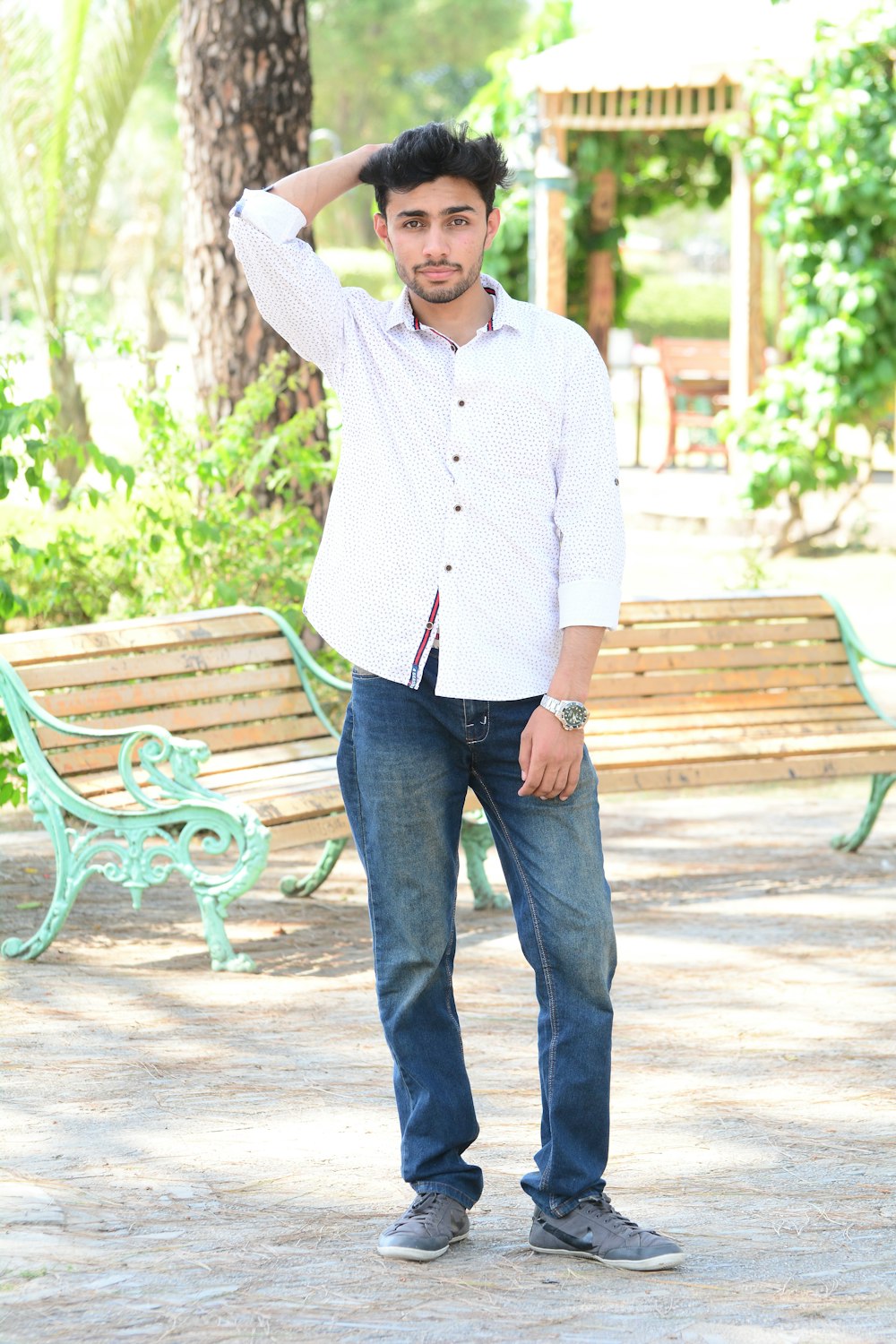 man standing near bench