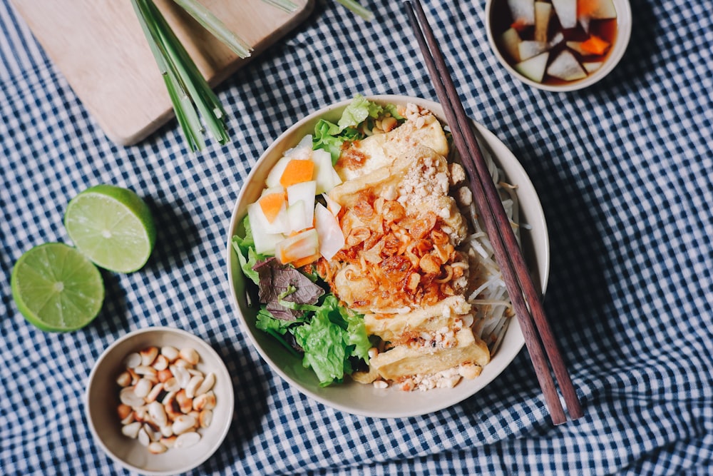 flat lay photography of food in bowl with chopsticks