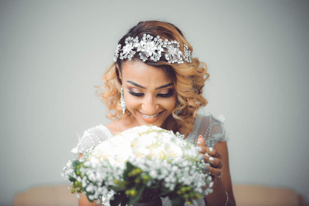 smiling woman wearing white headband