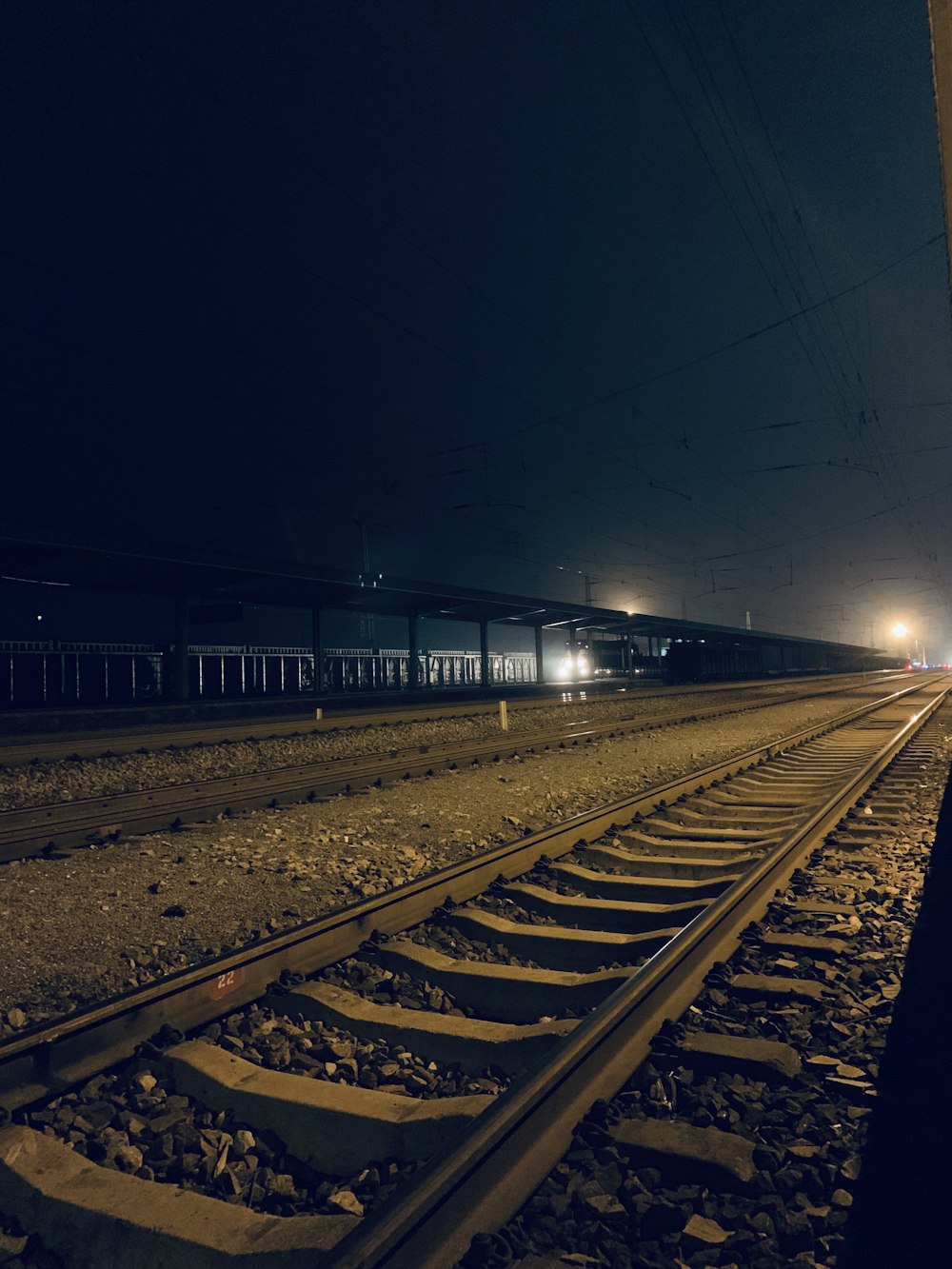 gray train tracks at night