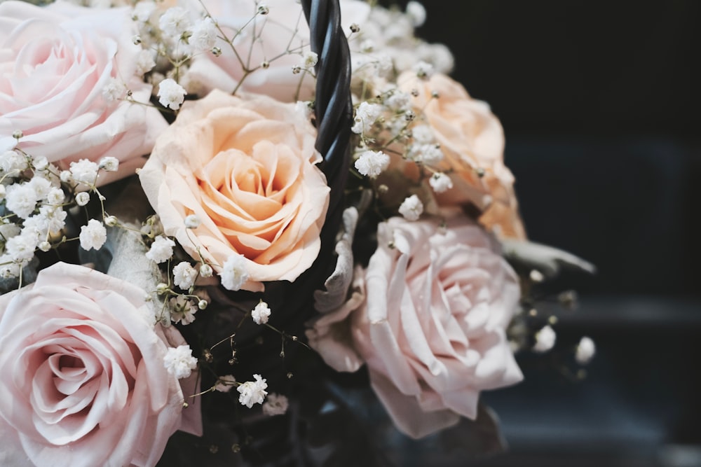 blooming beige rose flowers and white Baby's Breath bouquet