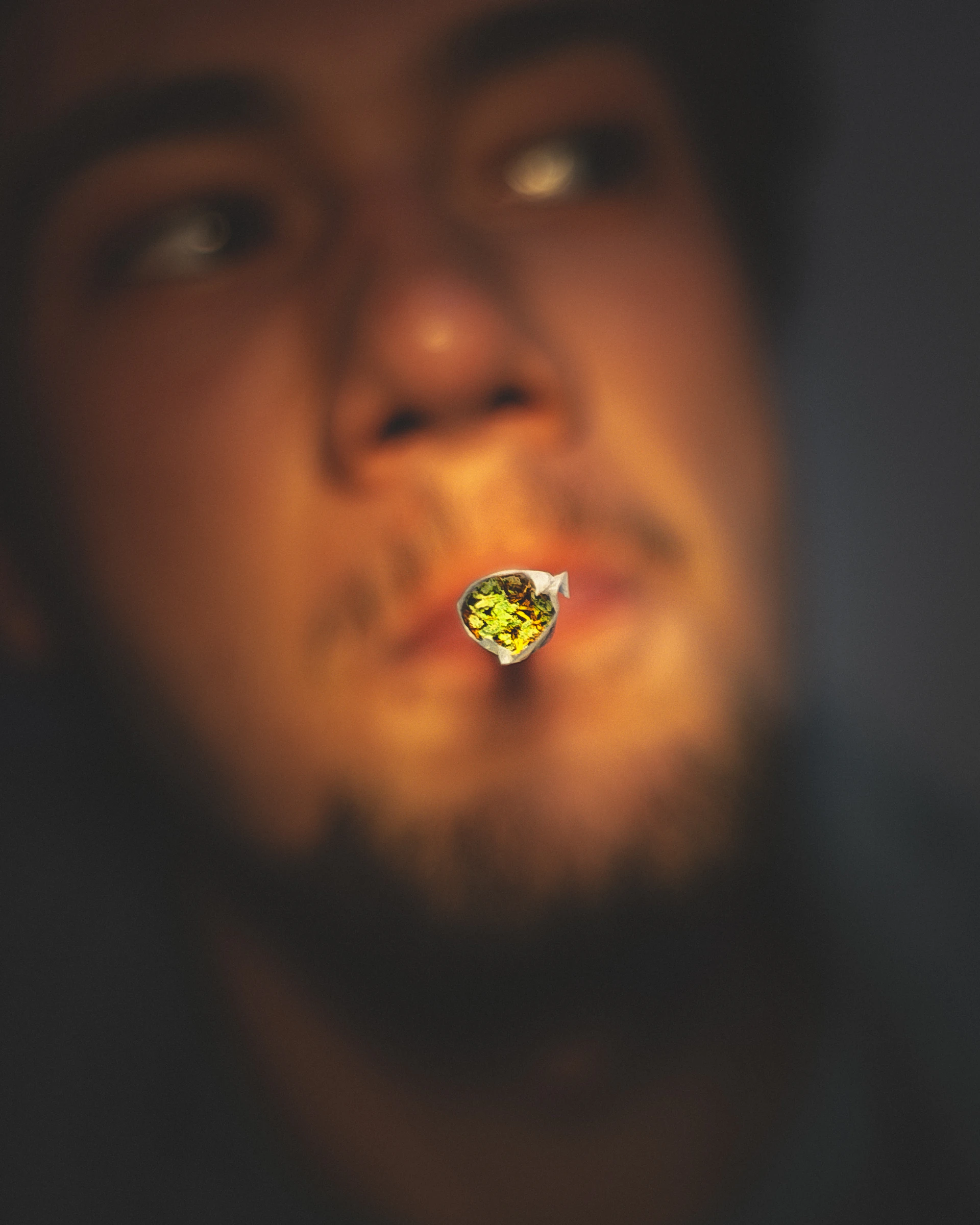 man puffing joint