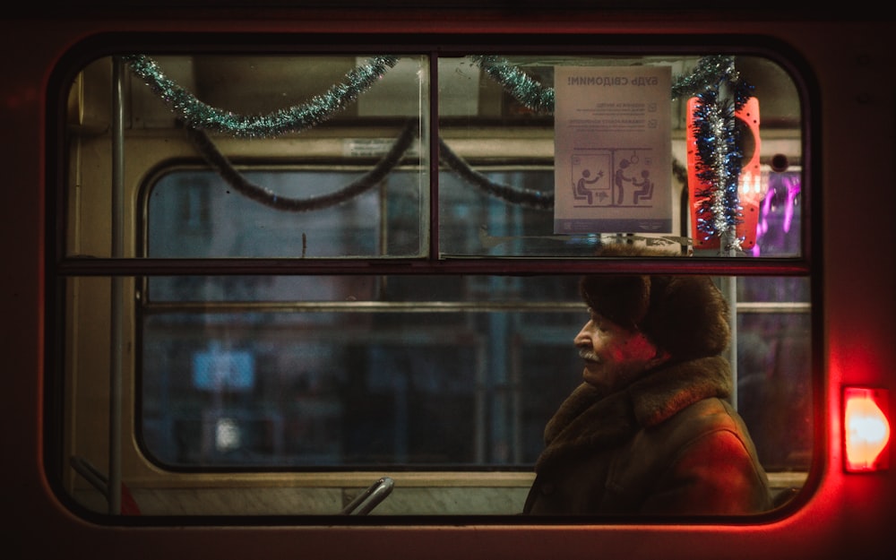 man sitting inside train