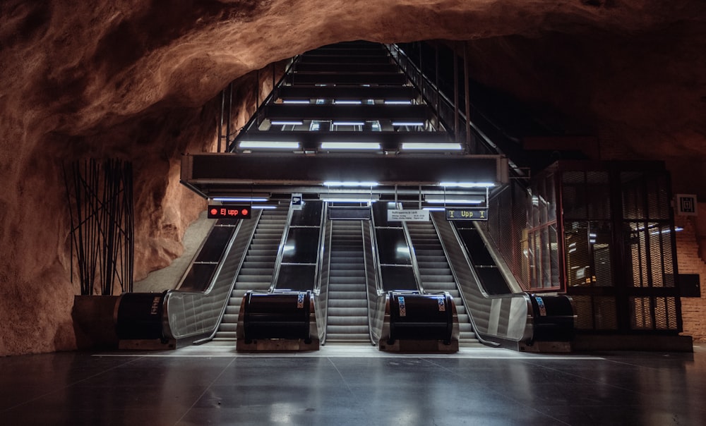 empty three escalator inside cave