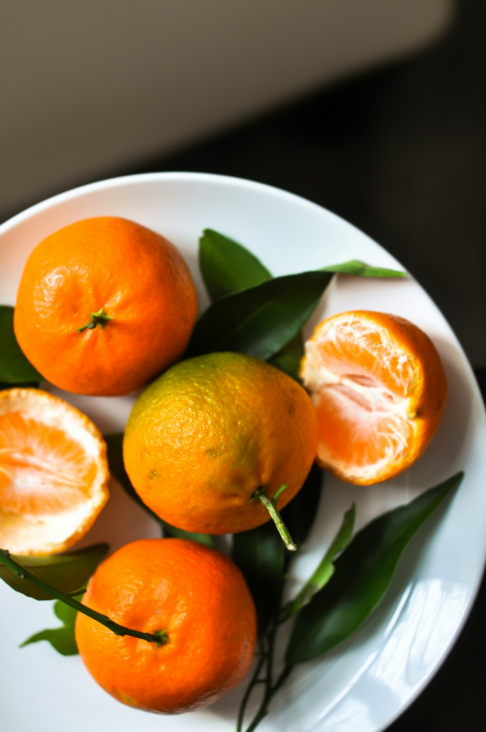 orange fruits on plate