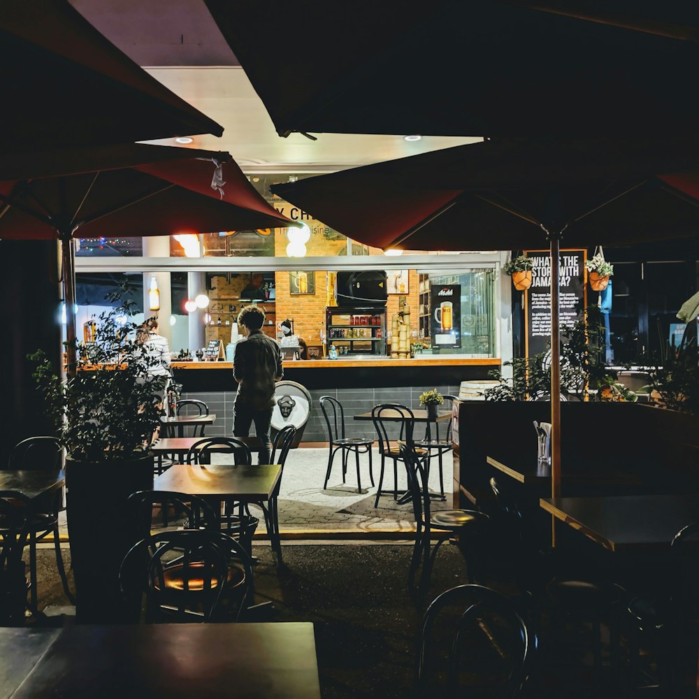 man stands near empty diner