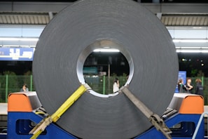 Wide shot of the production line with HR coils being processed and prepared for shipment