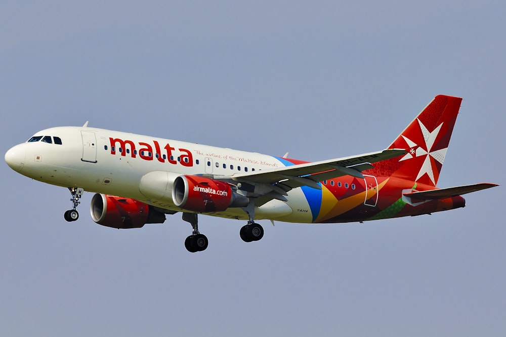 Malta airliner in mid air during day