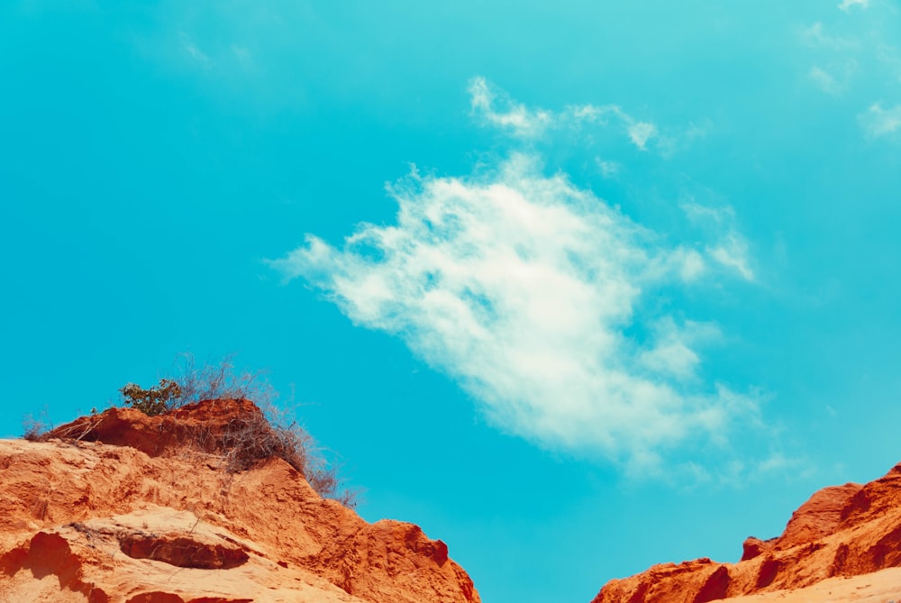 brown rocks under blue sky