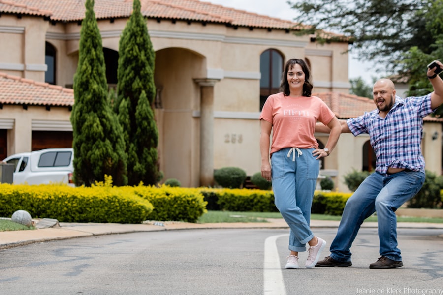 Couple in front of their new home in Ecuador