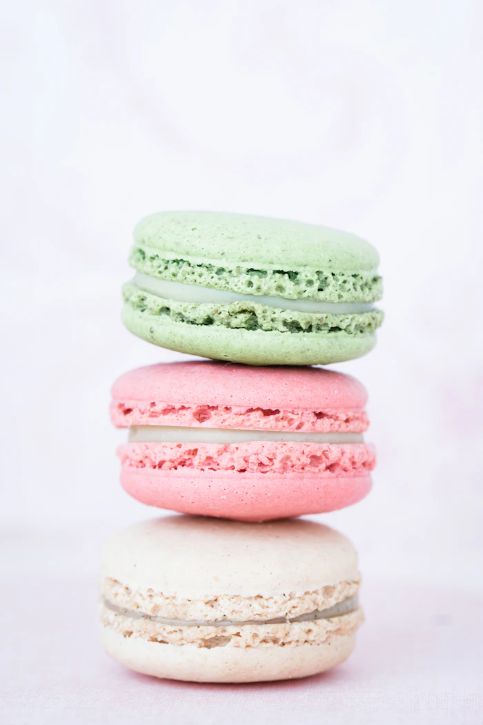 Three pastel macarons
