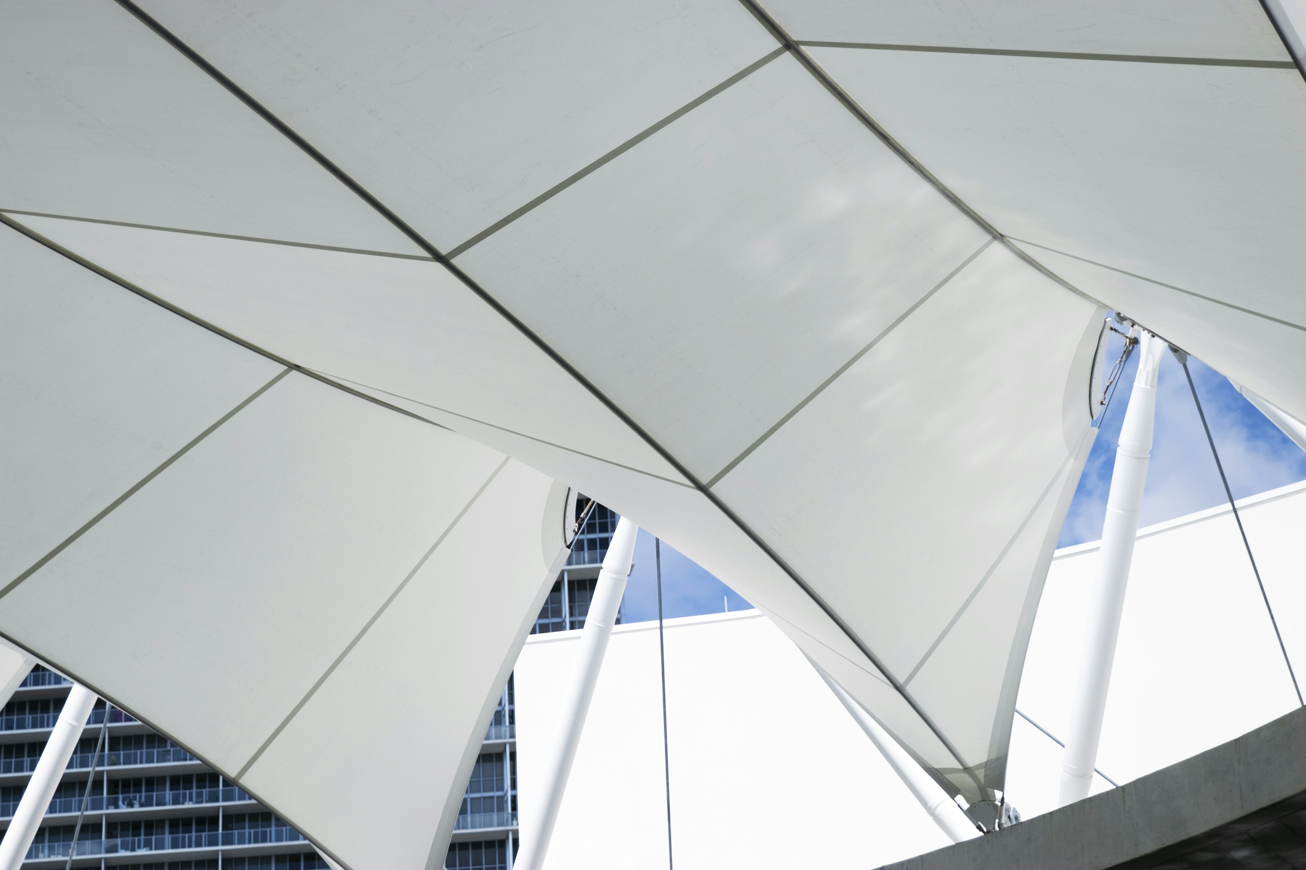 a large white structure with a sky in the background