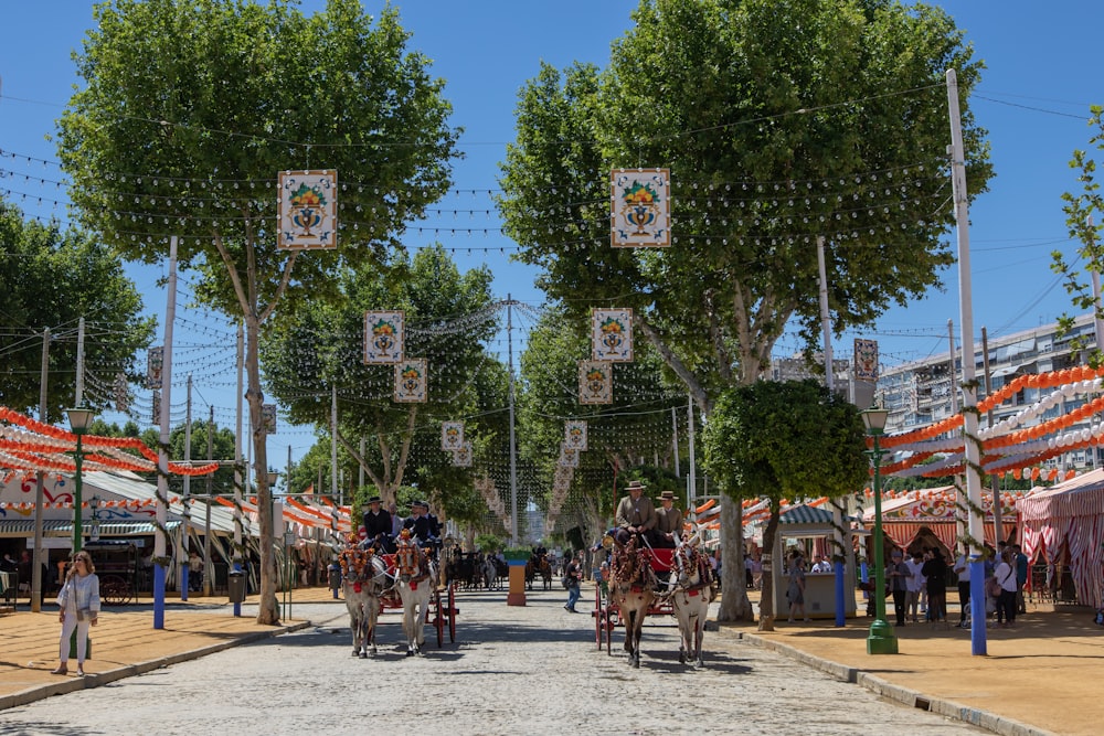 people riding on horses during daytime