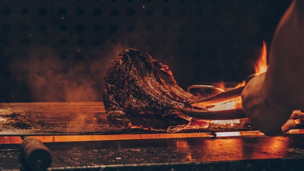 An inviting image of a perfectly grilled steak on a kamado grill.