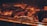 Several pieces of meat are being grilled over an open flame. The surface of the meat is charred, indicating high heat and searing. The glowing embers and fiery orange hue create a warm atmosphere.