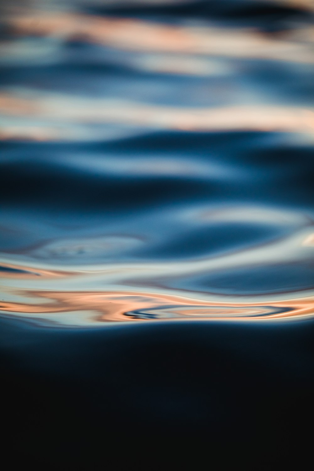 calm body of water close-up photography