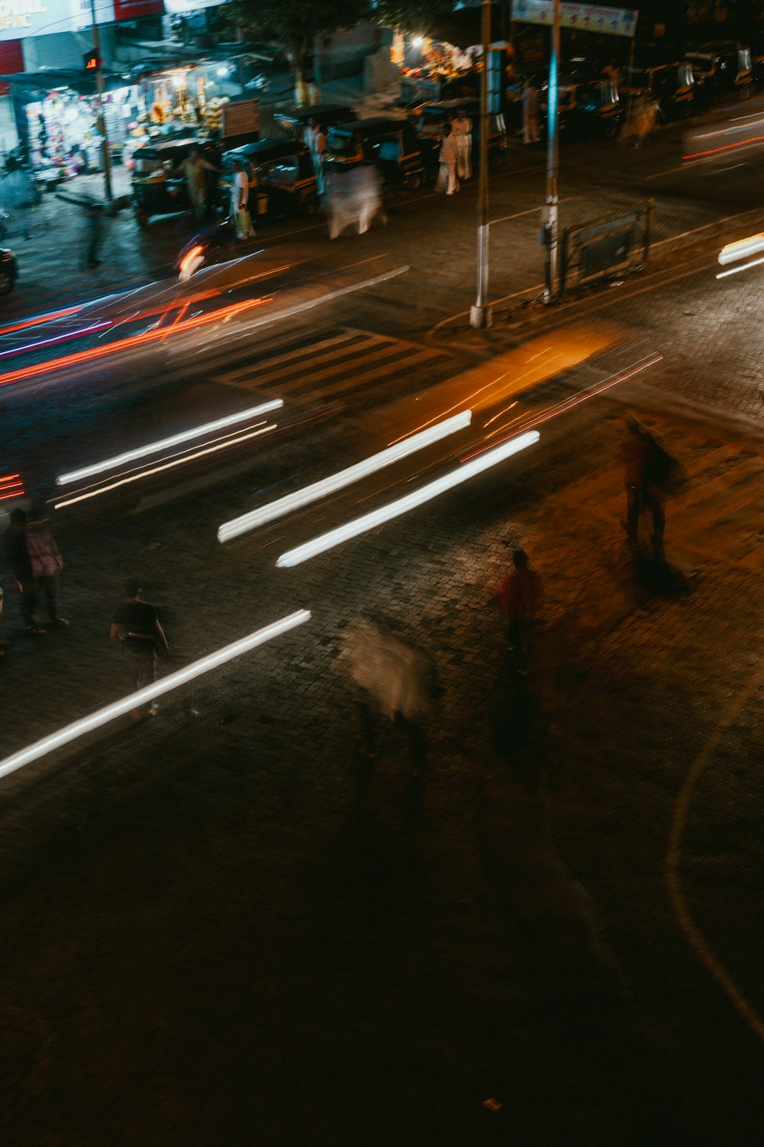 time-lapse photography of moving vehicle on road