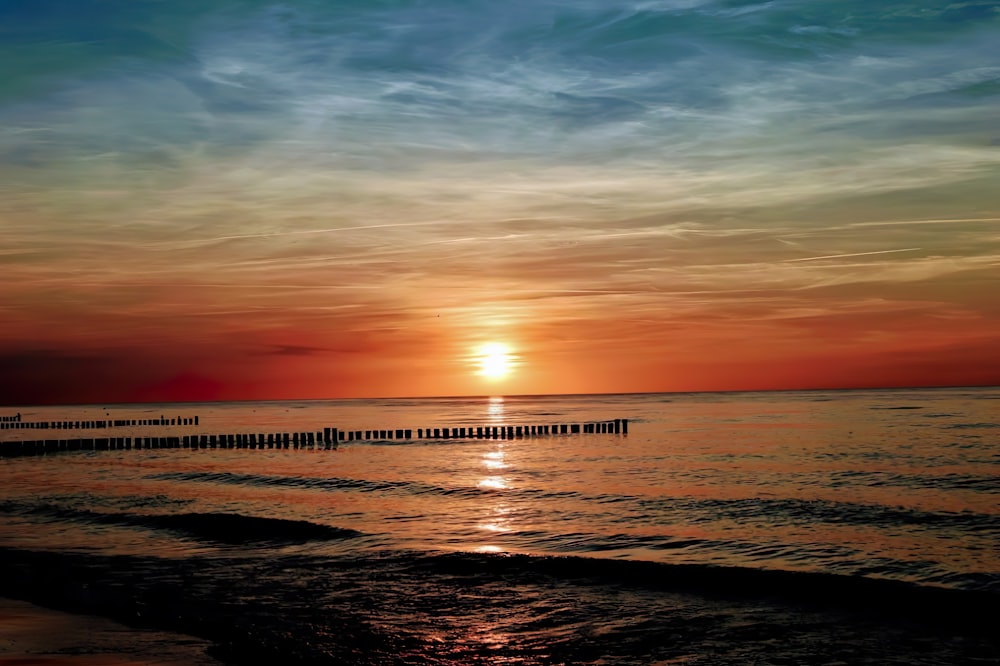 calm sea under sunset