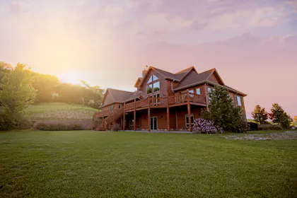 Country house on an open grassy field