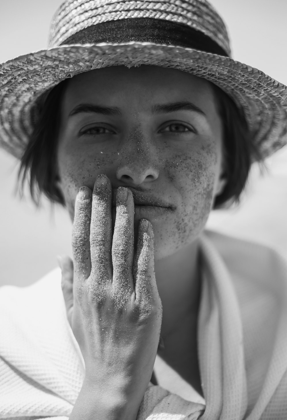 grayscale photography of woman wearing sunhat