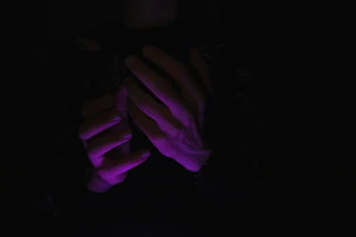 A serene mystical purple and gold themed contact form glowing softly in the dark.