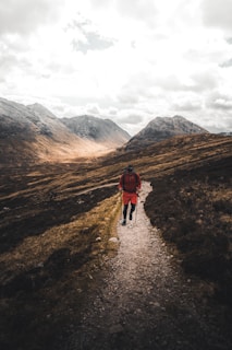 man walking on road under dramatic clouds symbolising video production companies nyc