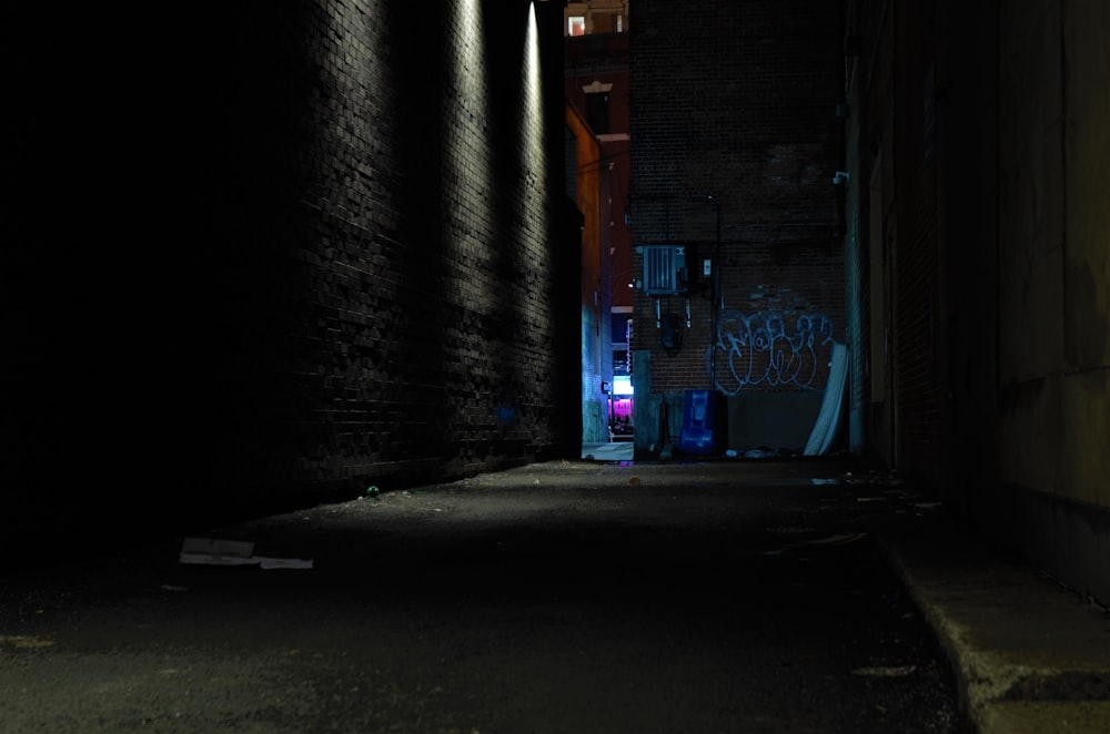 Person In A Alley During Nighttime With Lights Photo Free Grey Image On Unsplash