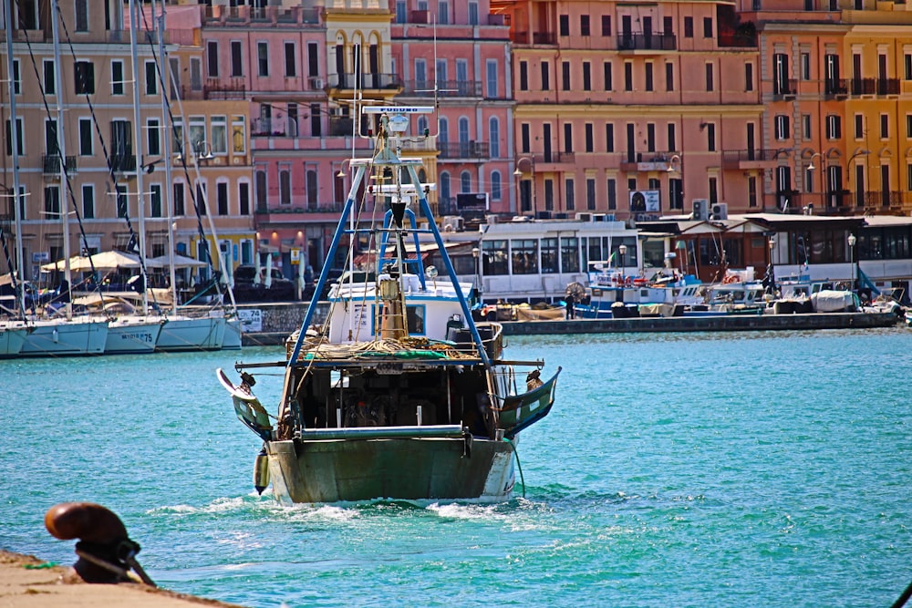 gray and white boat in body of water during daytime