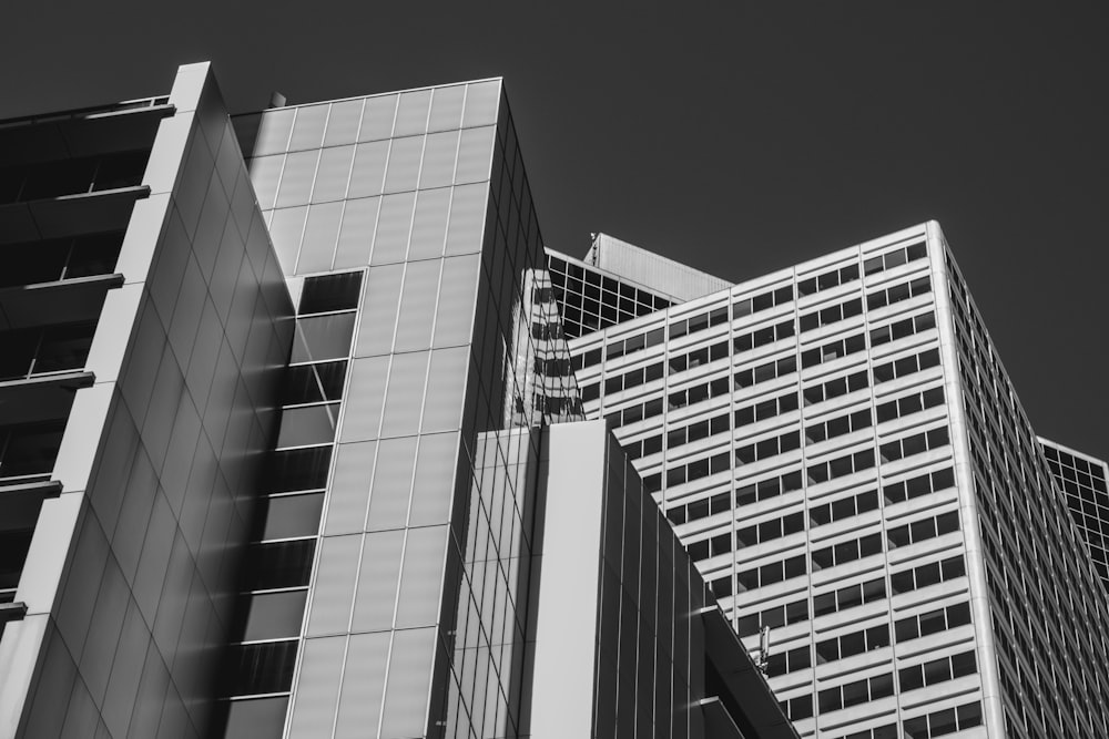 greyscale photo of high-rise building