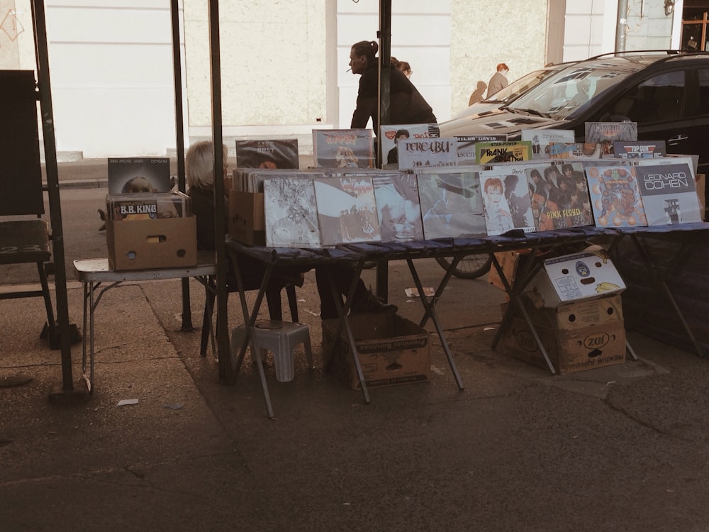 assorted vinyl records lot on display in sidewalk