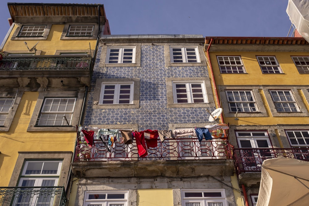 worm's-eye view of yellow and gray apartment