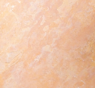 an orange and yellow marble textured background