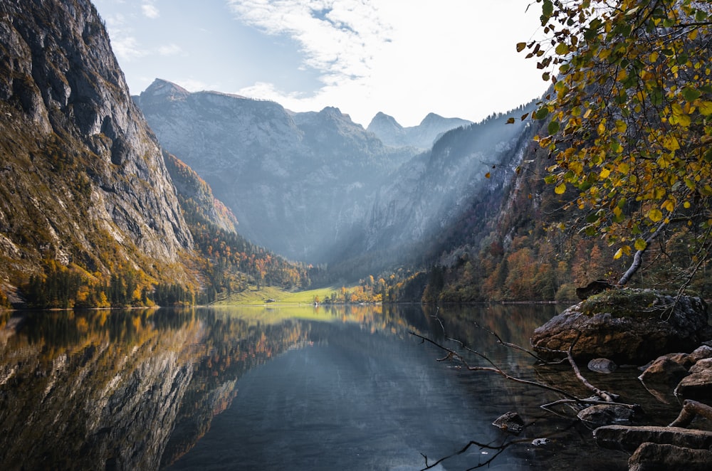 mountain beside body of water during daytime