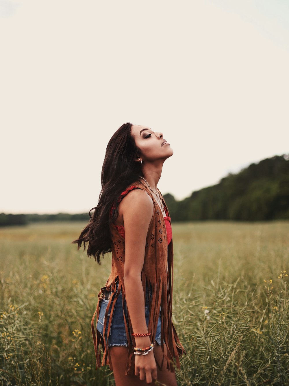 woman standing near grass field