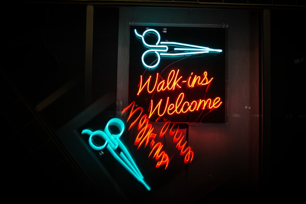 green and orange Walk-ins Welcome neon sign