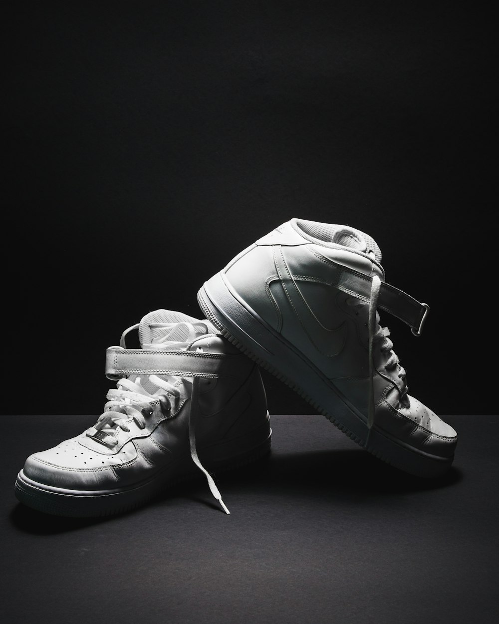 pair of white Nike Air Force 1 sneakers