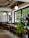 Cozy interior of Monteclaro coffee shop with modern black and white decor accented by green cedar details