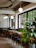 Cozy interior of Monteclaro coffee shop with modern black and white decor accented by green cedar details