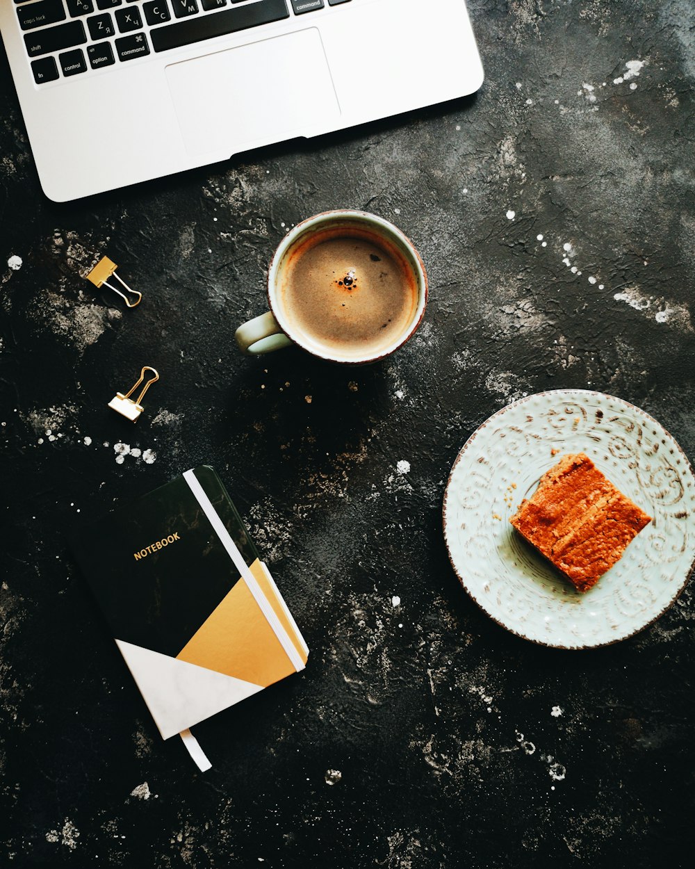 flat lay photography of slice cake, laptop and cup of coffee