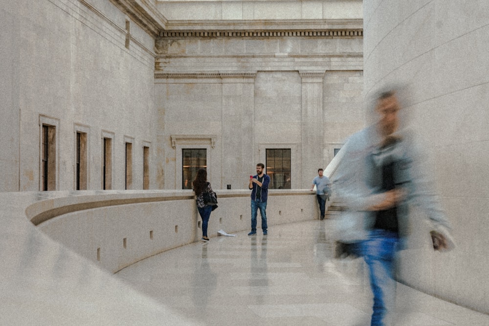 people walking around the building