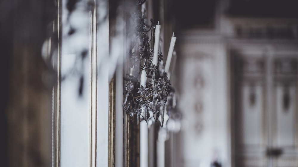 a close up of a mirror with a reflection of a building