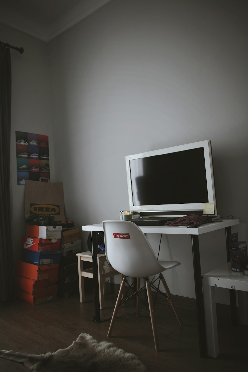 turned-off white flat screen monitor on white wooden desk